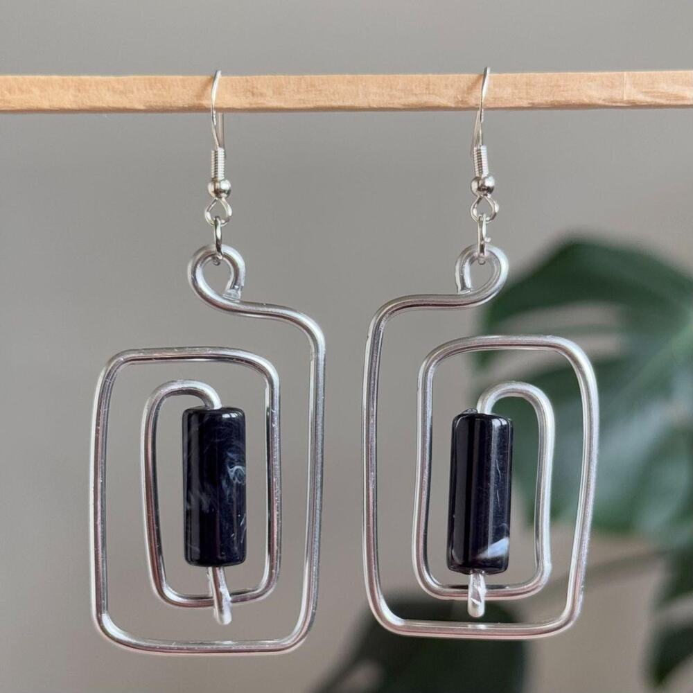 handmade silver wire spiral earrings with black colored tube beads